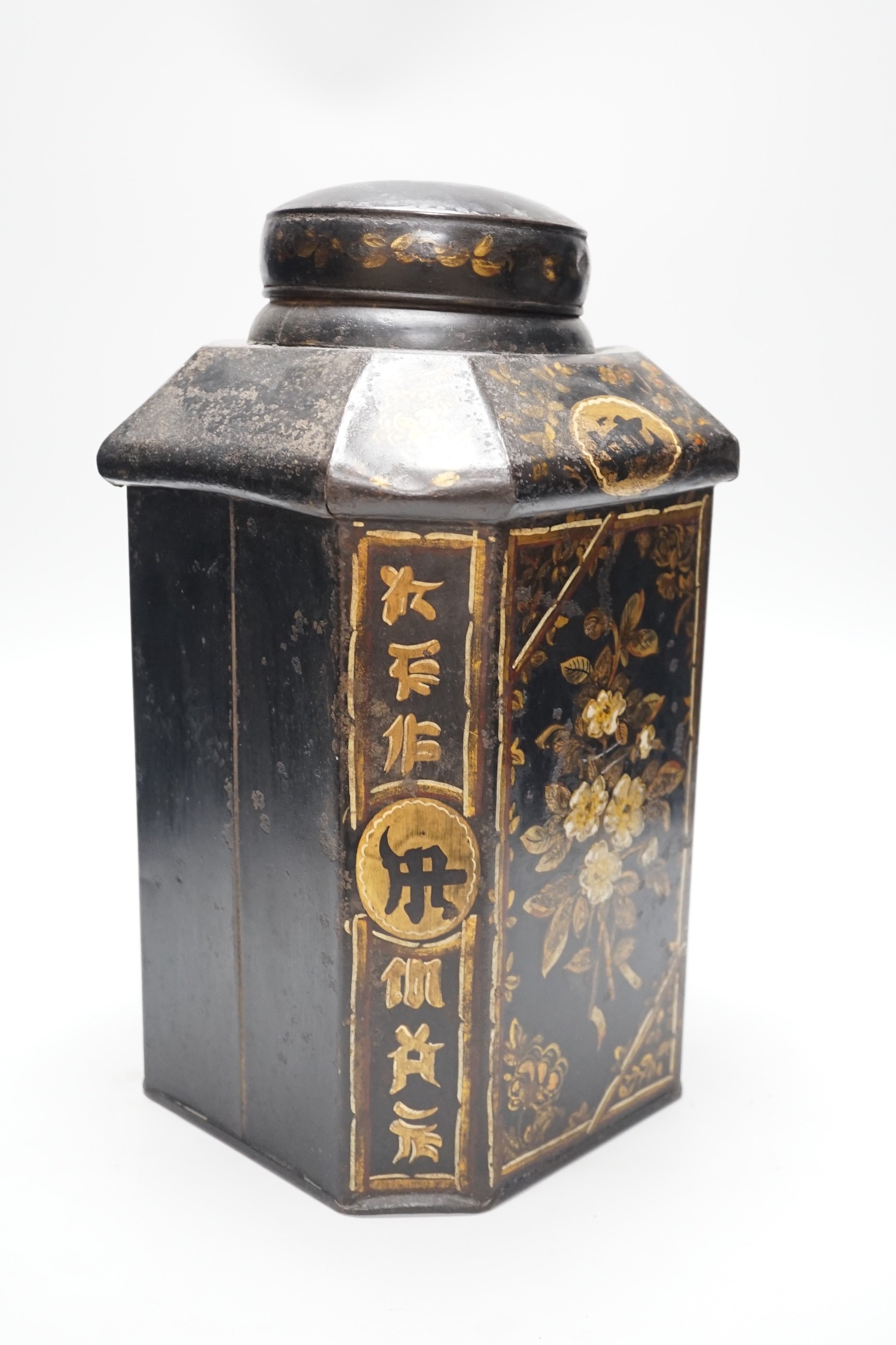 A 19th century toleware octagonal tea canister, J. Newman, Dublin, painted with flowers and Chinese script, 36cm